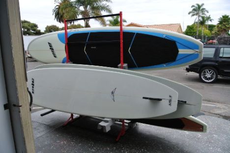 Stack of paddle boards outside store front