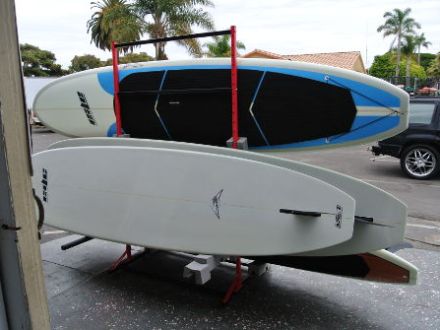 Stack of paddle boards outside store front